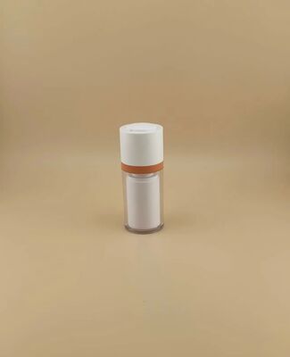 Drehflasche mit transparenter Außenhülle für Kosmetika