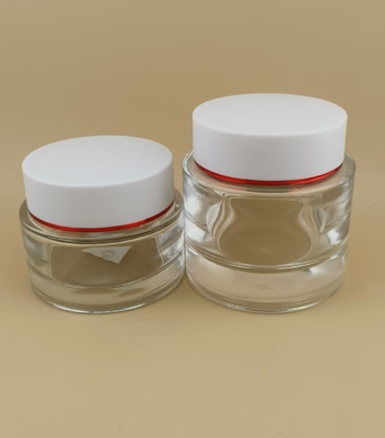 Klarer Glas-Cremebehälter mit weißem Schraubdeckel für Damen-Lotion