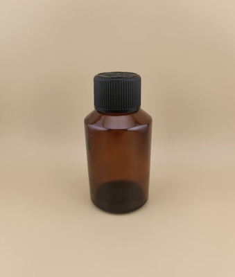 Zartes Design, klare, braune, glatte, runde Glasflasche mit speziellem Deckel für Medikamente