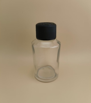 Zartes Design, klare, glatte, runde Glasflasche mit speziellem Deckel für Medikamente